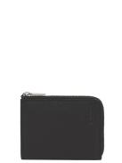 Image of <p>Porte-monnaie zippé Charles de chez Le Tanneur est un modèle intemporel fabriqué en cuir de vachette pleine fleur. <br />D'une grande qualité, il conservera son élégance au fil des années. <br />Ses dimensions permettent d?accueillir 2 cartes bancaires