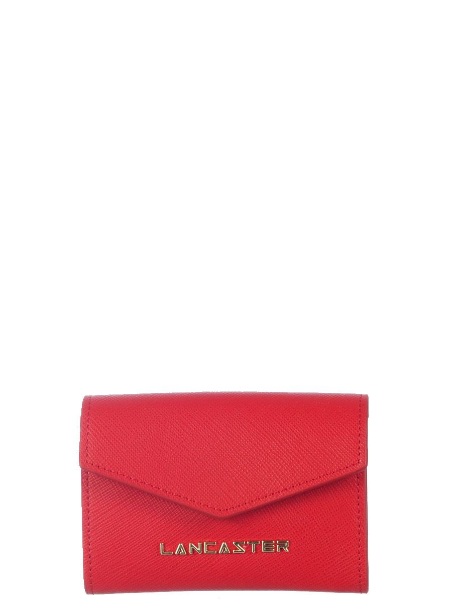 Image of <p>Charmant petit porte-monnaie <strong>LANCASTER</strong> en refente de cuir au grain saffian.<br /> Il est composé de deux poches à soufflets avec une poche de séparation à fermeture Eclair, d'une fente pour carte bancaire et d'une poche extérieure au d
