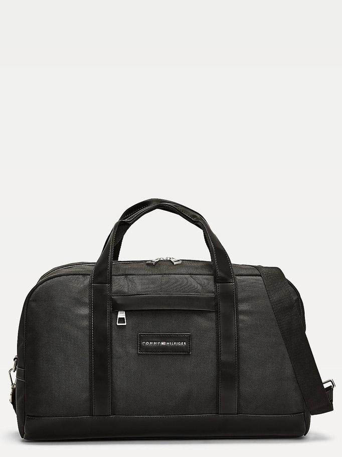 Image of <p>Sac de sport ou sac de voyage cabine <strong>Tommy Hilfiger</strong> "Uptown" en polyester recyclé. <br />Il présente des pochettes pour ordinateur portable et tablette intégrées et des détails emblématiques de la marque Tommy Hilfiger.<br /> Poche ext